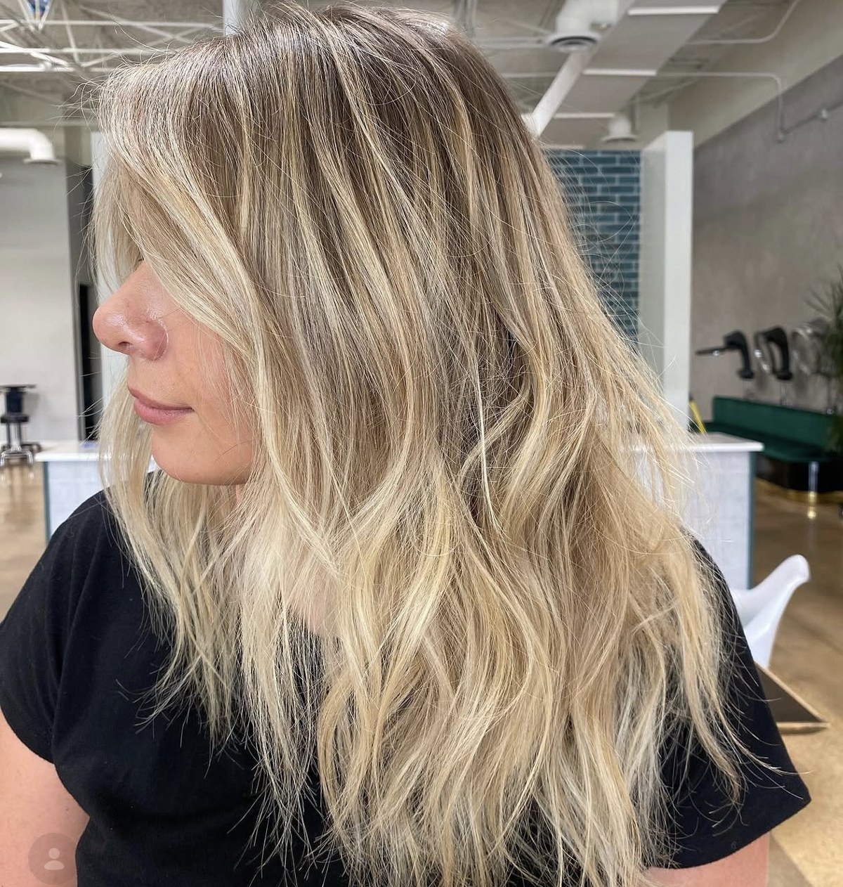 Textured shoulder-length blonde haircut
