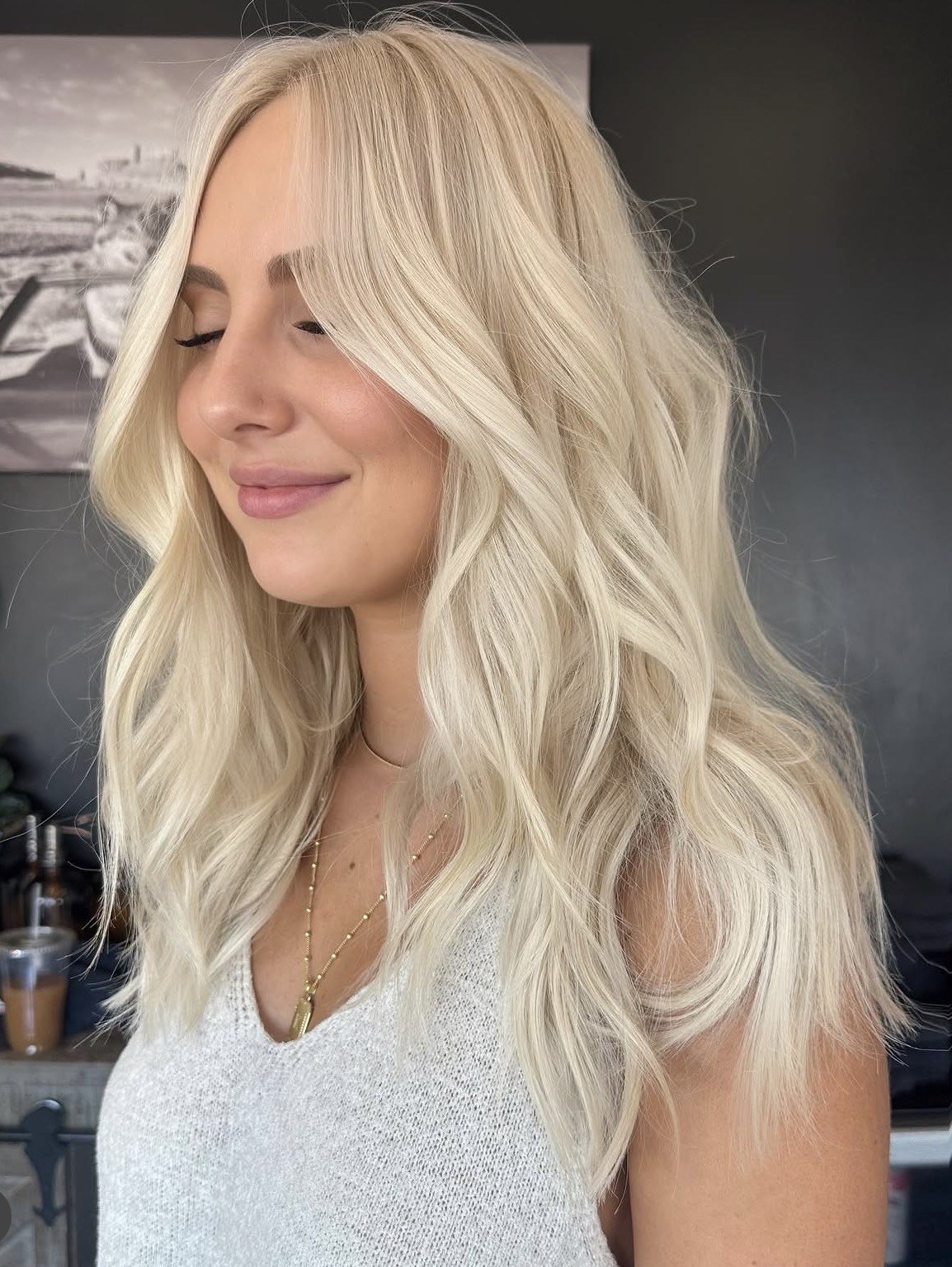 Bright blonde waves and soft face-framing layers