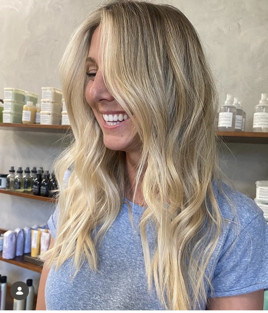 Soft, bright blonde waves on a smiling client by Megan Beth Hair